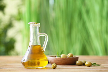 Jug of olive oil on table outdoors