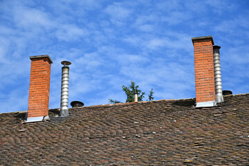 Smoke stacks on the roof of a building