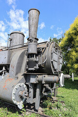Fototapeta na wymiar Old locomotive next to the railway station