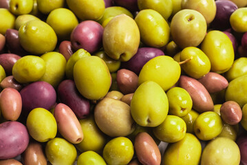 Tasty mix olives background.
