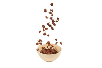 Chocolate corn flakes falling to the white bowl isolated on white. Motion.