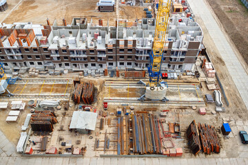The aerial view a construction site of a multistory residential building in a city