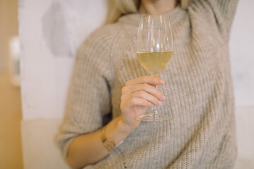Fototapeta premium Woman drinking white wine at date. Close up.