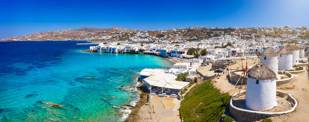 Panoramic view to the old windmills  and the beautiful town of Mykonos island, Cyclades, Greece - obrazy, fototapety, plakaty