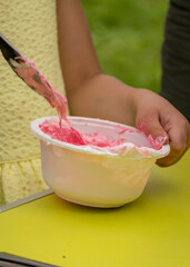 bowl with a colorful slime, making a slime at a birthday party, children's games - making a slime