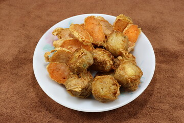 Traditional deep fried crab meat roll and spring roll on the plate. Famous crispy and crunchy menu in Chinese dim sum. 