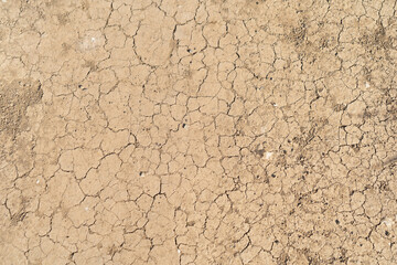 Dry ground rough cracks in the land with sand in desert. serious water shortages and Drought barren...