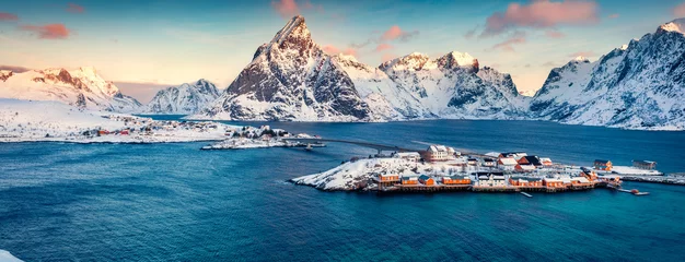 Foto op Canvas Aerial morning cityscape of Sakrisoy port. Panoramic view of Lofoten Islands with Kvalvik bridge. Amazing winter sunrise on Norwegian sea. Great outdoor scene of Norway. Life over polar circle. © Andrew Mayovskyy