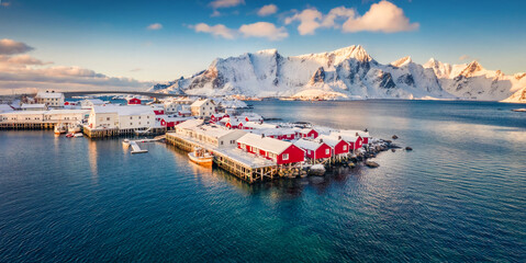 View from flying drone of small fishing town - Hamnoy, Norway, Europe. Panoramic morning seascape of Norwegian sea. Fantastic winter scene of Lofoten Island. Life over polar circle.