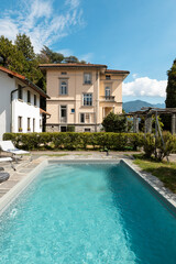 Ancient villa with swimming pool on a sunny summer day