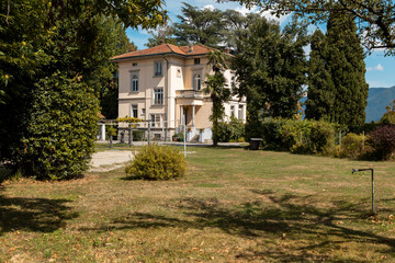 Ancient villa surrounded by nature in the hills in Switzerland. Sunny summer day