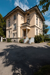 Ancient villa surrounded by nature in the hills in Switzerland. Sunny summer day