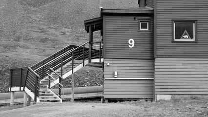 Entrance to the wooden barrack number nine in Nybyen on the island Spitsbergen