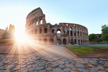 Naklejka na ściany i meble Sunrise at Rome Colosseum (Roma Coliseum), Rome, Italy - Colosseum amphitheater in Rome