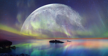 Northern lights (Aurora borealis) in the sky with super full moon - Tromso, 
 Norway 