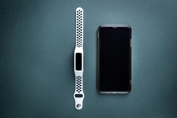 Set of mobile Smart phone and Smart watch on black background, top view