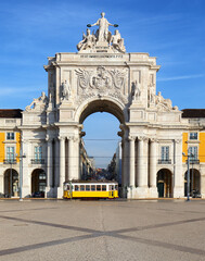 Fototapeta na wymiar Praca do Comercio with yellow tram, Lisbon, Portugal