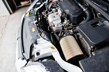 Car repair and maintenance theme. Mechanic in uniform working in auto service.