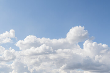 Naklejka na ściany i meble Blue sky with large white clouds, sky background.