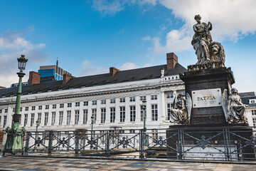 Naklejka premium Historical Pro Patria memorial in the neoclassical Place des Martyrs or Martelaarsplein in Bruxelles bears freedom and revolutionary concept. Belgian Revolution Pro Patria monument - Brussels, Belgium