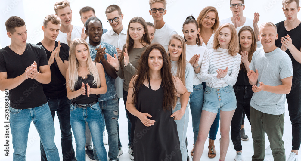 Wall mural group of diverse young men and a girl leader standing together