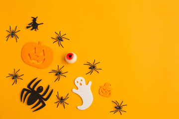 Halloween decorations with black spiders, crazy pumpkins and ghost