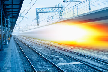 Fototapeta premium High speed train runs on rail tracks - Train in motion