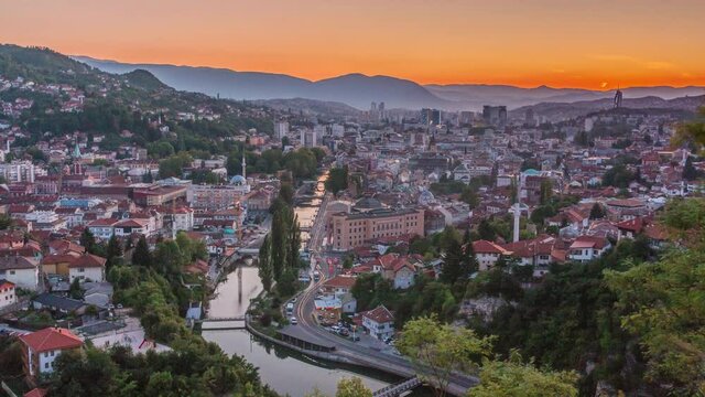 Sunset view of Sarajevo with river from most popular panoramic spot in Sarajevo timelapse. Road near Yellow Fortress (Zuta Tabija), Vratnik