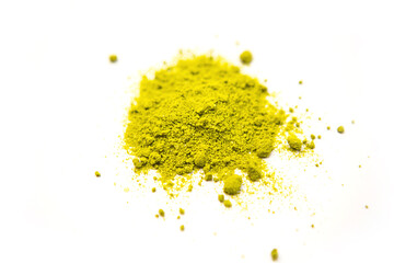 Green powder of Japanese matcha tea on a platter, isolated on a white background. Loose powder. Space for text. Cafe and cooking, an ingredient for an invigorating drink