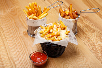 french fries with cheese sauce and ketchup