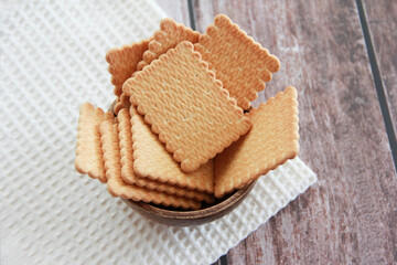 edible square dry cookies in a plate
