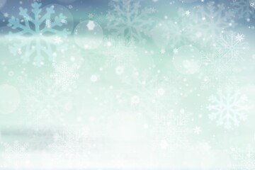 Naklejka premium Blue green abstract christmas background with snowflakes white bokeh stars blurred beautiful shiny light, use for card new year wallpaper backdrop