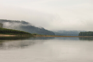Fototapeta na wymiar Cloudy weather on the river.