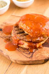 Delicious Turkish islak hamburger or wet burger on wooden table