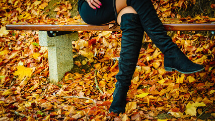 Woman wearing black knee high boots
