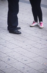 People walking sidewalk pavement
