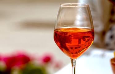 Two glasses of delicious Aperol Spritz cocktail on blurred background from Venice