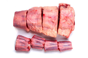 Raw ox tail cut into portions, White background. Meat industry concept, Top down view.