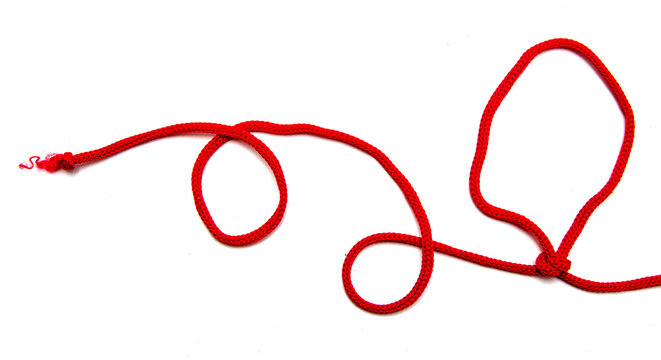 Red Twine With Knots On A White Background.