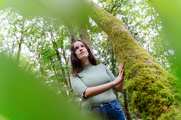 Beautiful woman in touch with nature. Green environmental lifestyle.