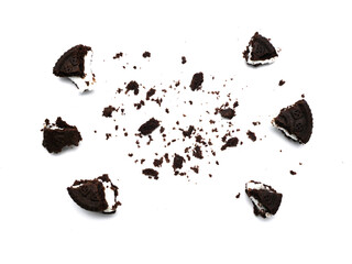 Sandwich chocolate cookies with a sweet cream with crumbs isolated on white background.