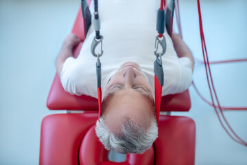 Elderly lying male patient with closed eyes