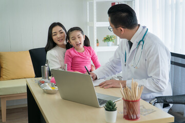 Fototapeta premium Preschool age girls have a checkup at a clinic