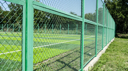 Mesh fence in the football field.