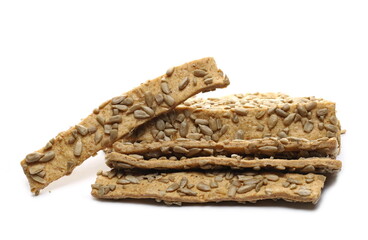 Integral pastry sticks with sunflower seeds isolated on white background