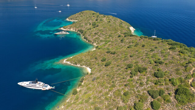 Aerial drone photo of secluded paradise sandy bay a safe anchorage for sail boats and yachts with turquoise bay, Ithaki or Ithaca island, Ionian, Greece