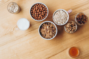 a delicious and crunchy oatmeal granola with honey, nuts, dried fruits and grains. Dynamic healthy food photography