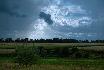 landscape with clouds, clouds over the field