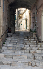  Typical cobbled stairs in a side street alleyway iin the Sassi di Matera a historic district in the city of Matera. Basilicata. Italy