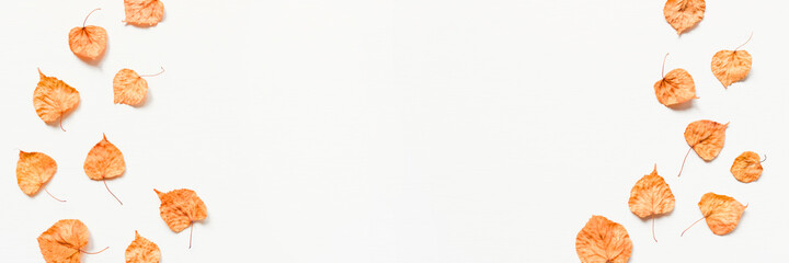 Autumn background made of dry yellow leaves. Flat lay, top view. Copy space for text.